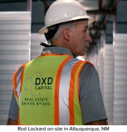 A rear-facing image of Rod Lockard conducting a tour of the DXD Albuquerque construction site