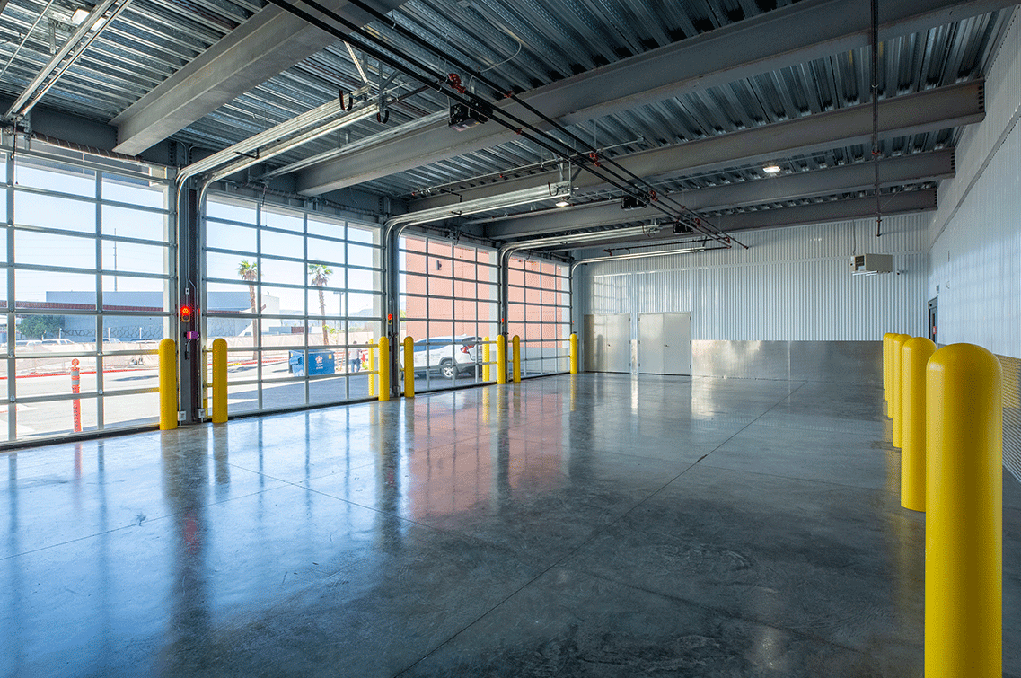 Image{width=1137,height=755,url='https://8488932.fs1.hubspotusercontent-na1.net/hubfs/8488932/FlamingoGallery-4.png',altText='An interior shot of the extra large four-door entry stall of DXD Capital's facility on Flamingo Rd in Las Vegas.',fileId=null}