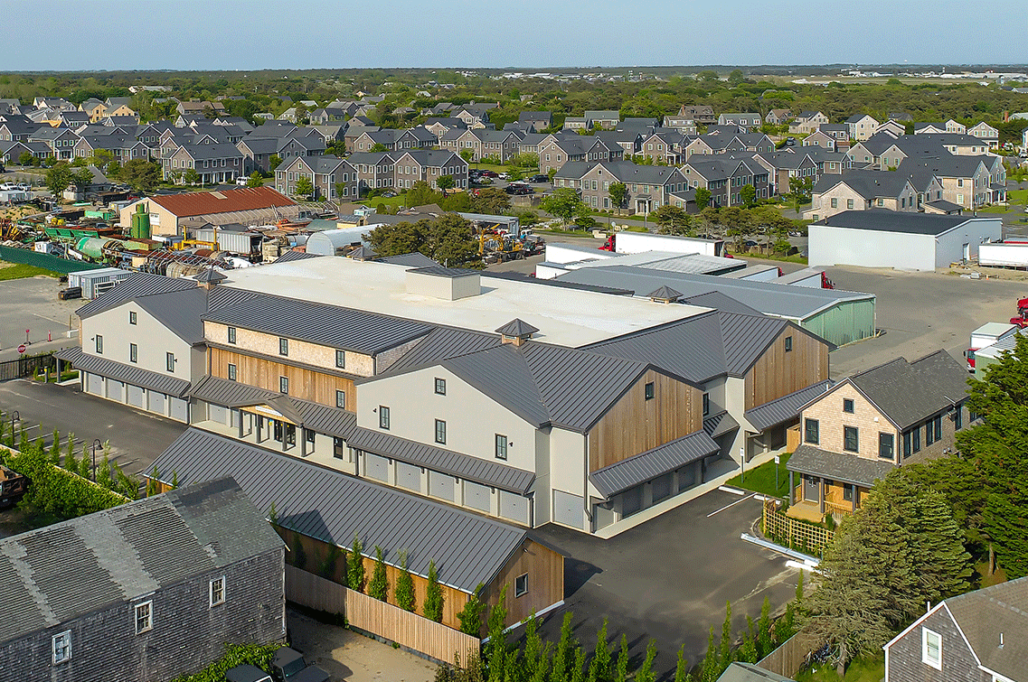 Image{width=1137,height=755,url='https://8488932.fs1.hubspotusercontent-na1.net/hubfs/8488932/NantucketGallery-2.png',altText='A daytime aerial shot of DXD Capital's self storage facility on Nantucket Island. The photo shows how well the New England architecture matches with the surrounding building and homes in the area.',fileId=null}